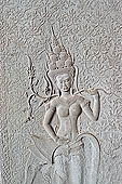 Angkor Wat temple, third enclosure, devatas sculpted in bas-relief with an extraordinary variety of intricate hair styles and costumes. 